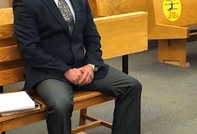 Elementary school principal Robin McGrath awaits the resumption of his trial in Provincial Court in St. John's after the lunch break Monday. McGrath has pleaded not guilty to charges of assaulting and threatening students.