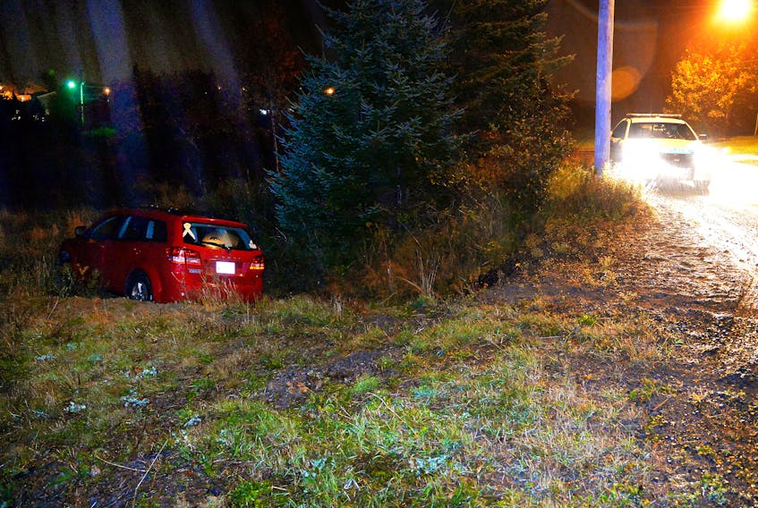 The driver of an SUV was not seriously injured after the vehicle went over an embankment in Torbay Sunday night. Keith Gosse/The Telegram
