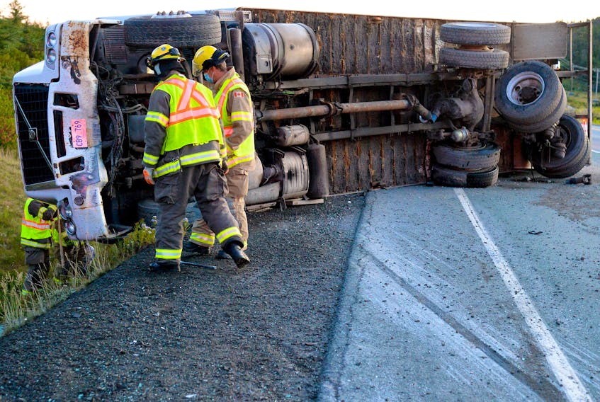 The driver of a cargo truck was taken to hospital after the truck he was driving overturned on the Trans-Canada Highway Monday morning. Keith Gosse/The Telegram