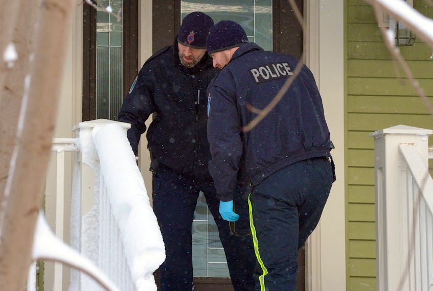 Royal Newfoundland Constabulary officers investigate a drive-by shooting on Craigmillar Avenue Friday morning. Keith Gosse/The Telegram