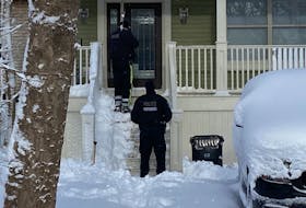 Royal Newfoundland Constabulary officers investigate an incident involving shots fired at 40 Craigmillar Avenue in St. John's early Friday morning. It's the same residence where 47-year-old Jamie Cody last summer.