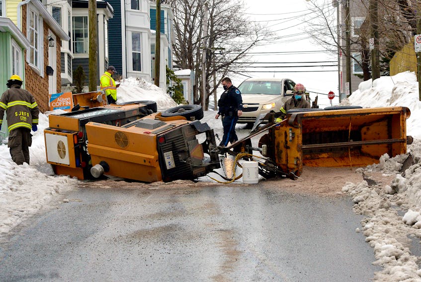 A city of St. John's worker was sent to hospital after the sidewalk plow he was operating overturned Wednesday morning. Keith Gosse/The Telegram