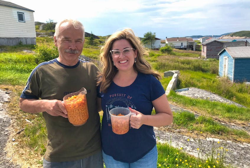 The fruits of our labour. The father in-law, David Pickett, is a man on a mission picking berries. Our jugs were to the top until the berries settled and juices started to form. – Paul Pickett photo