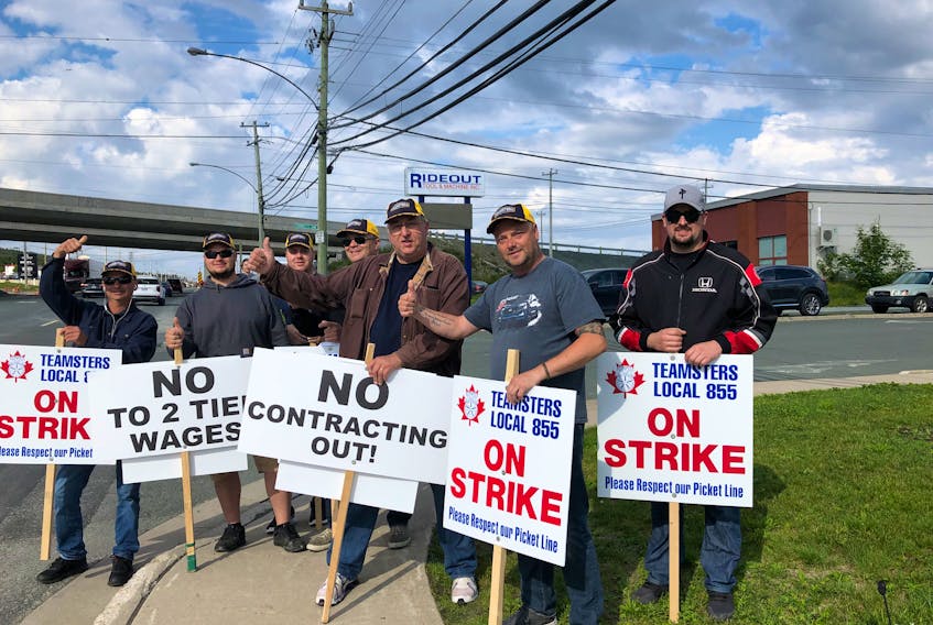 Honda employees picketing outside Mazda on Kenmount Road Friday morning. Teamsters Local Union 855 says work is getting sent from the unionized Honda shop to the non-unionized Mazda shop while Honda workers are on strike. -