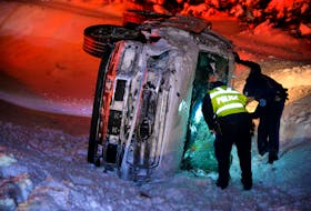 One man was in custody after his pickup overturned on the Outer Ring Road Sunday night. Keith Gosse/The Telegram