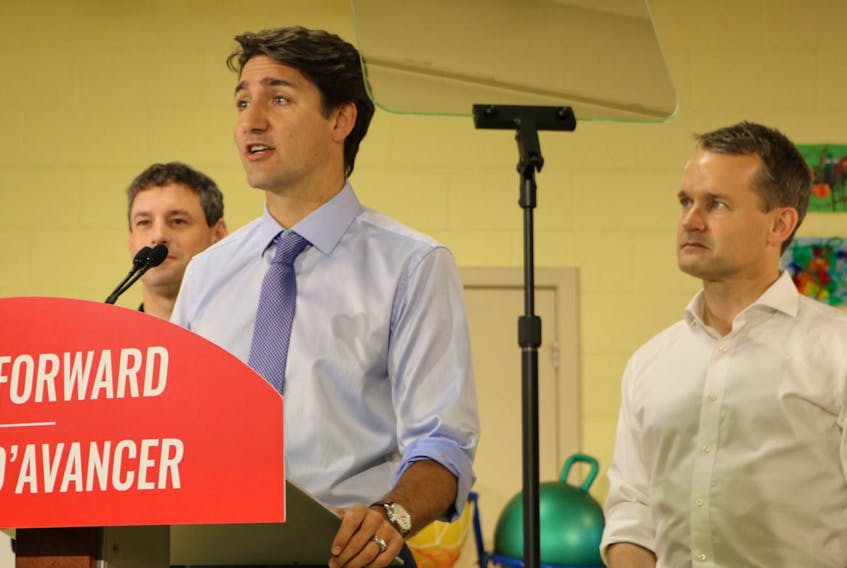 Liberal Leader Justin Trudeau speaks in St. John’s during a campaign stop in the city Tuesday morning. Looking on are Nick Whalen (left), Liberal incumbent in St. John’s East, and Seamus O’Regan, Liberal incumbent in St. John’s South-Mount Pearl.