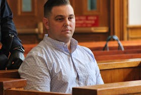 Craig Pope sits in the prisoner's dock at Newfoundland and Labrador Supreme Court in St. John's Wednesday, awaiting the start of his sentencing hearing.
