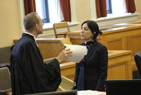Crown prosecutor Jude Hall speaks with linguist Pouneh Shabani-Jadidi of McGill University, who testified as an expert witness at the attempted murder trial of a MUN student in St. John's Wednesday. Shabani-Jadidi translated text messages between the accused and his brother from Farsi to English.