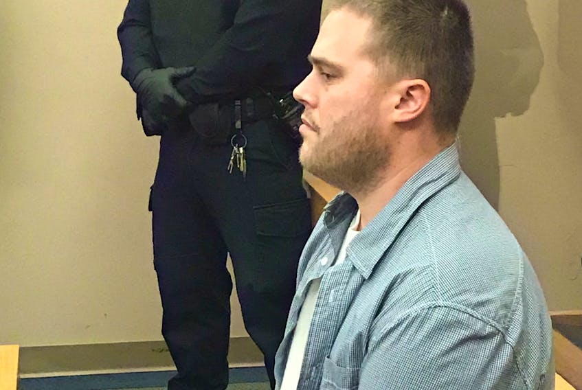 Lyndon Butler, 29, waits for Judge James Walsh to arrive and his bail hearing to begin Thursday in provincial court in St. John’s.
