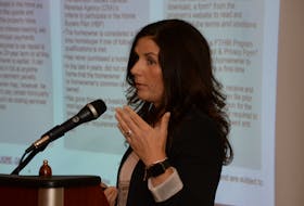 Anne Norwood of the Canada Mortgage and Housing Corp. speaks about the CMHC’s First Time Home Buyer Program Tuesday at the Airport Comfort Inn in St. John's during the Newfoundland and Labrador branch of the Canadian Home Builders Association's monthly membership meeting.