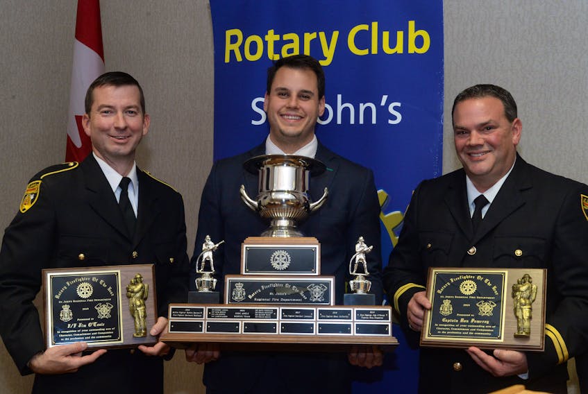 Rotary Club of St. John’s president Paddy Greene (centre) presented the firefighter-of-the-year awards to SJRFD firefighter Jim O’Toole (left) and Capt. Ron Pomeroy (right).