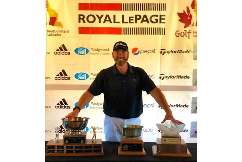 Chuck Conley poses with his trophy haul after winning the amateur, mid-amateur and senior golf titles at the 2019 Royal LePage provincial men’s golf championships Sunday in Corner Brook.