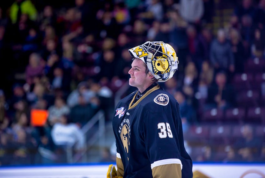The colour scheme is pretty close, but that's a Michigan Tech logo still on the helmet of Newfoundland Growlers goaltender Patrick Munson. The 24-year-old Munson picked up his first North American pro win Saturday night at Mile One Centre, where the Growlers defeated the Reading Royals 3-2 in overtime. The Royals and Growlers are back at it tonight at Mile One in what will be their third straight game. — Newfoundland Growlers photo/Jeff Parsons