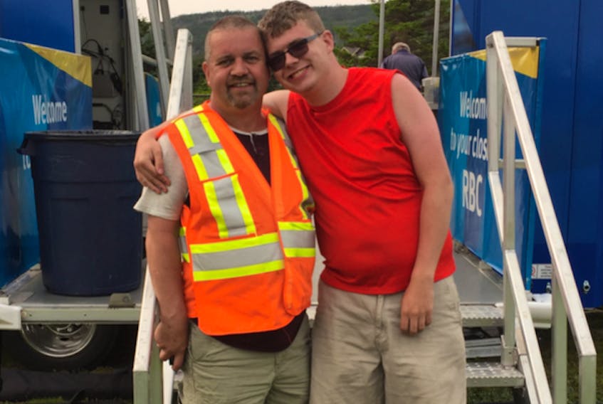 Jake Griffiths (right) hugs his father, Ray, during the inaugural Jake’s Show ’N’ Shine car show held in Dunville in 2018. The car enthusiasts are busy preparing for the 2nd annual Show ’N’ Shine scheduled for Aug. 24 in support of the Autism Society of Newfoundland and Labrador.