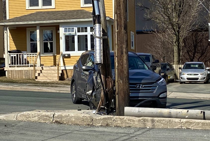 A single-vehicle accident caused damage to two utility poles on Adam's Avenue in St. John's Friday afternoon. Keith Gosse/The Telegram