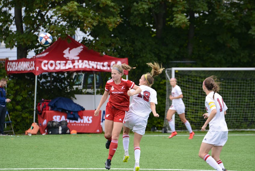 Bethany Hynes (left) of the Memorial Sea-Hawks women's soccer team heads a ball during the Sea-Hawks' last AUS game, a 0-0 tie with the Acadia Axewomen Sept. 29 in St. John's. Hynes is one of 20 players on the team who participated in the recent national women's championship. The Memorial men's and women's sides play road games in Nova Scotia this weekend. — Memorial Athletics/Dani Ahmad