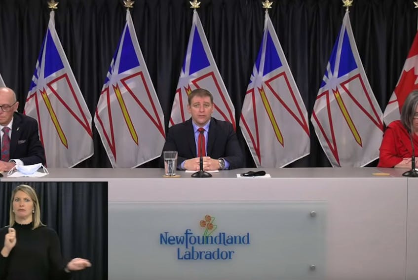 From left, Health Minister John Haggie, Premier Andrew Furey and Chief Medical Officer of Health Dr. Janice Fitzgerald are show at a COVID-19 video briefing on Wednesday, Nov. 18. Inset: Heather Crane, ASL interpreter.