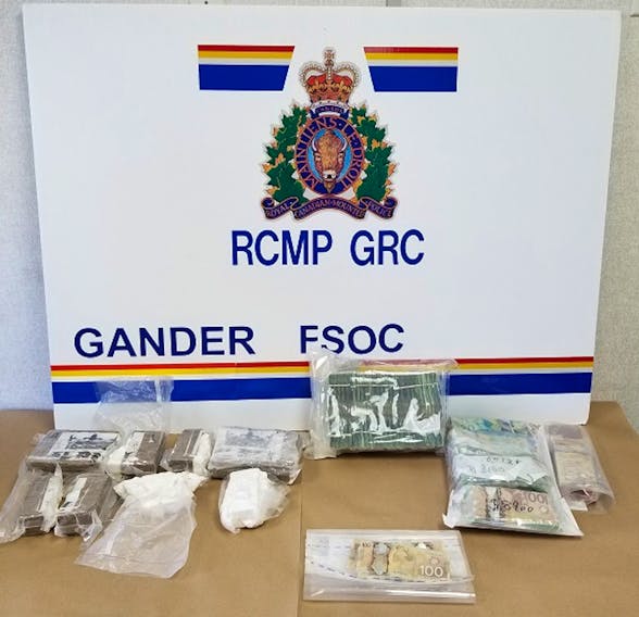 The RCMP sent out this picture of the cocaine and cash seized after a truck stop in the Hare Bay-Dover area on Monday. — Contributed