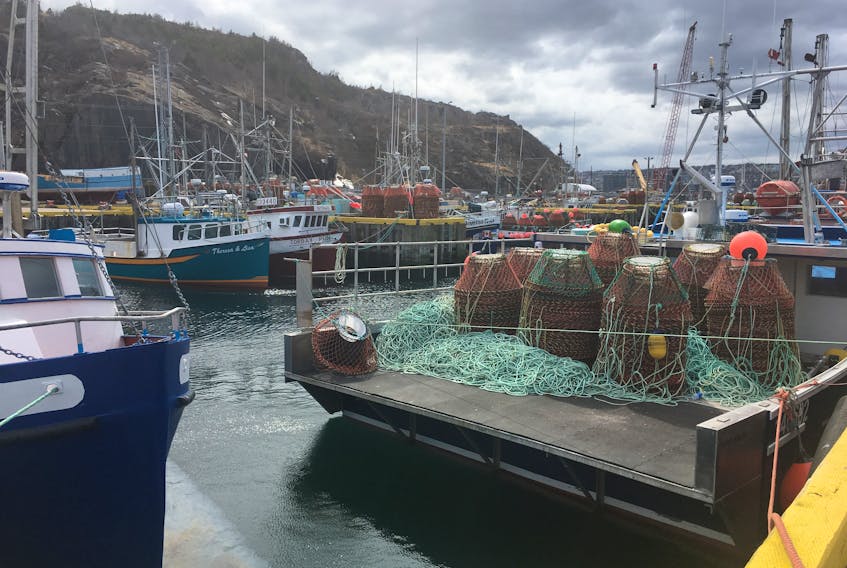 Crab bots sit on the deck of a boat in St. John's harbour.