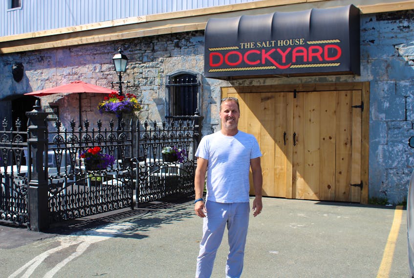 Vic Lawlor poses outside the entrance to his Dockyard bar facility, a companion area to go with The Salthouse Restaurant on Water Street in St. John’s. Lawlor has been locked in a battle over permits for several months with the City of St. John’s and ultimately the Newfoundland Liquor Corporation, who said his premises must meet the city’s requirements to be able to serve alcohol at the location on Harbour Drive.