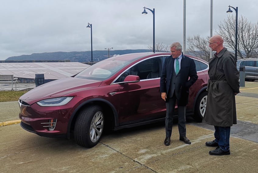 Premier Dwight Ball stands with Jon Seary of Drive Electric NL Wednesday at the Confederation Building during the viewing of electric cars.