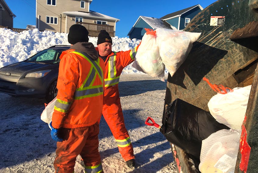 Crew members with the Town of Paradise are being kept busy today at the Milton Road softball field, where residents are dropping off their garbage and recyclables as part of the town's efforts to help out after the snow storm and state of emergency interrupted collection.  — ROSIE MULLALEY/The Telegram