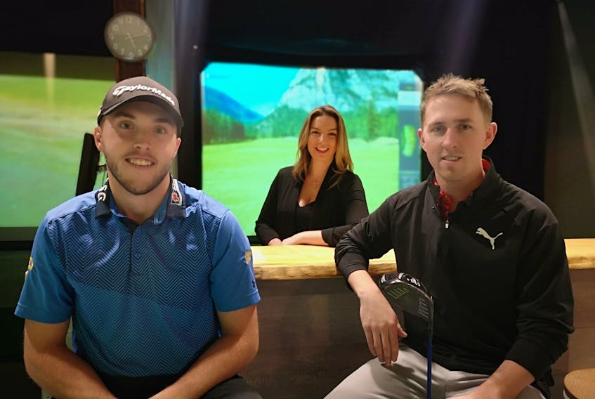 Blair Bursey (from left), Tara O’reilly and Trevor Hefferan. Bursey is a professional golfer from Newfoundland who just finished his first year. He dropped by Tara O’reilly and Trevor Hefferan’s new business Golfshotz, a sports bar with indoor golf simulators. Andrew Waterman/The Telegram