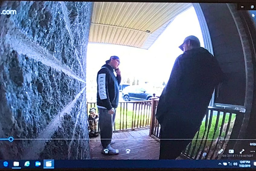 A still photo taken from video footage shown during Justin Jennings’ extortion trial in provincial court in St. John’s Monday. Jennings is alleged to have knocked on the door of a Mount Pearl man’s home and informed him he was there to collect a $37,000 debt. The man’s doorbell camera is said to have captured the exchange. Police say Jennings is the man on the left.