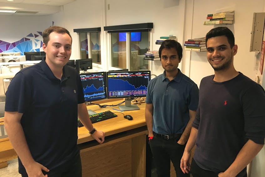 Three of MUN’s student-managed investment fund team members (from left) portfolio manager Scott Vatcher, Meghraj Mukhopadhay and Juan Grillo.