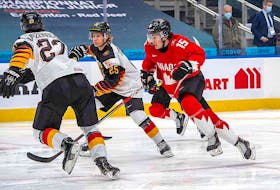 Team Canada is said to be "somewhat optimistic" Alex Newhook (15), shown skating against Germany in a preliminary-round game, will be able to play in today's world junior hockey semifinal game versus Russia in Edmonton.