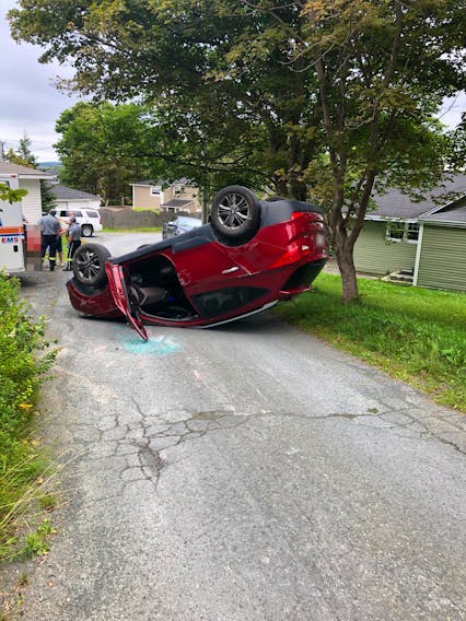 There had been three passengers still inside this driverless SUV when it rolled down a hill in Spaniard's Bay before flipping over. Fortunately, the only damage was to the vehicle. — Submitted/RCMP