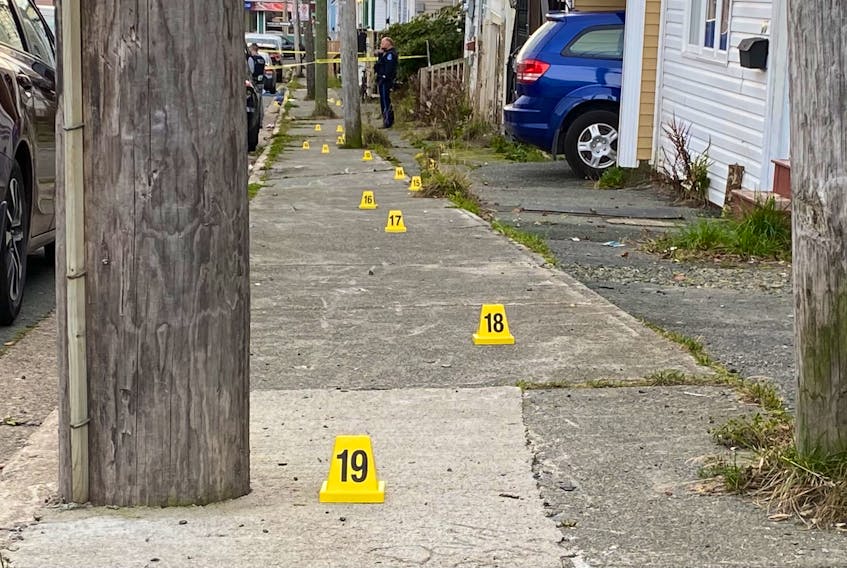 Crime-scene markers line the sidewalk on Spencer Street in St. John's, site of an altercation Wednesday morning that sent one man to the hospital with serious injuries. —Keith Gosse/The Telegram