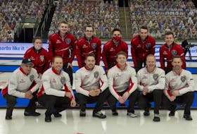 Members of the two St. John's-based teams competing at this year's Brier pose for a photo before their head-to-head matchup Wednesday night in Calgary. In the front row (left to right) are members of Team Canada: coach Jules Owchar,  lead Geoff Walker, second Brett Gallant, alternate Ryan McNeil Lamswood, third Mark Nichols and skip Brad Gushue. In the back row (left to right) are members of Newfoundland and Labrador's entry: coach Leslie Anne Walsh, lead Evan McDonah, second Alex McDonah, alternate Adam Boland, third Greg Blyde and skip Greg Smith. Team Canada won 11-3.