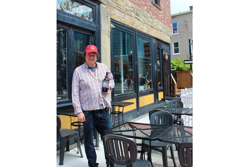 Craig Flynn, co-owner of Yellowbelly Brewery and Public House, stands on his newly expanded patio at the original Water Street location. He is hoping the patio will be open for the weekend.