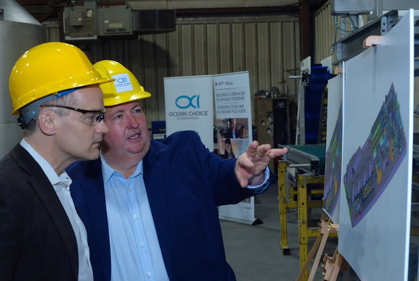 Blaine Sullivan (right) president of Ocean Choice International discusses plans for the company’s new fishing vessel, the Calvert, with South-Mount Pearl MP Seamus O’Regan following a news conference Thursday at the at the C & W Industrial Fabrication and Marine Ltd. facility in Bay Bulls.