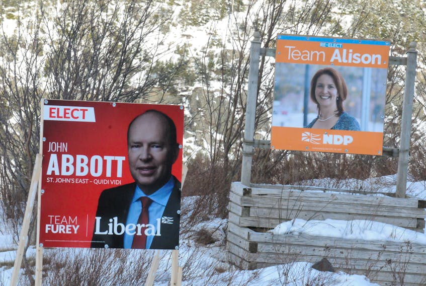 Election campaign signs for St. John’s East-Quidi Vidi candidates Liberal John Abbott and New Democratic Party (NDP) leader and incumbent MHA Alison Coffin on Forest Road near Quidi Vidi Lake, Thursday afternoon. Vaughn Hammond is running for the Progressive Conservatives in that district. The provincial general election is Feb. 13th. — Joe Gibbons/The Telegram