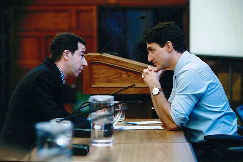 Quebec MP Anthony Housefather, left, speaks to Prime Minister Justin Trudeau.