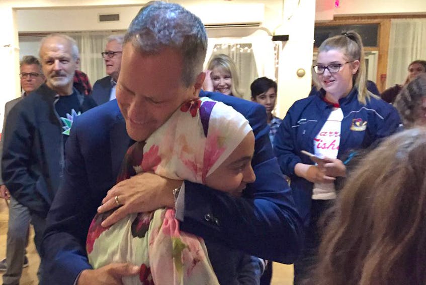 Darren Fisher hugs a supporter after winning his riding of Dartmouth-Cole Harbour.
