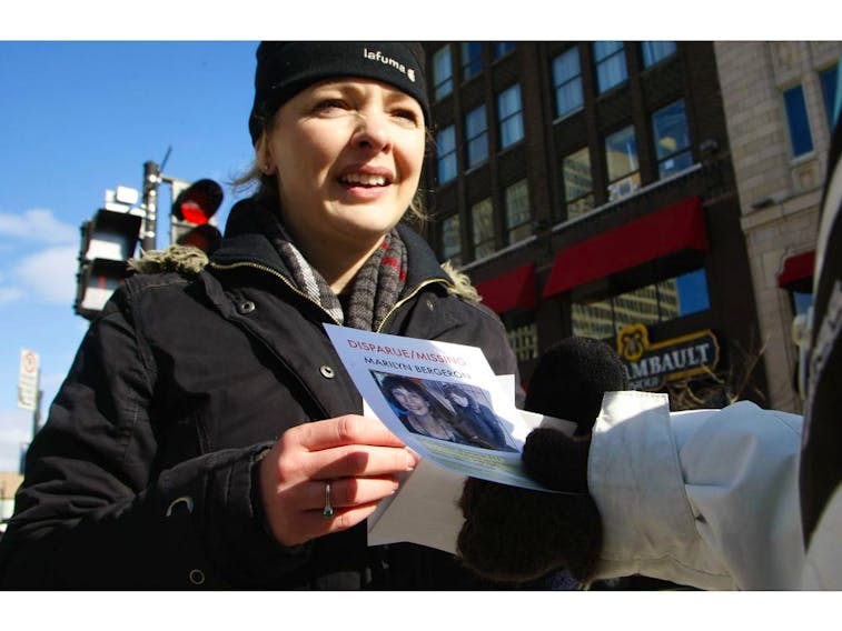 Nathalie Bergeron hands out flyers about her missing sister Marilyn Bergeron, next to Place Émilie-Gamelin in Montreal, Sunday, February 15, 2009.  - Phil Carpenter