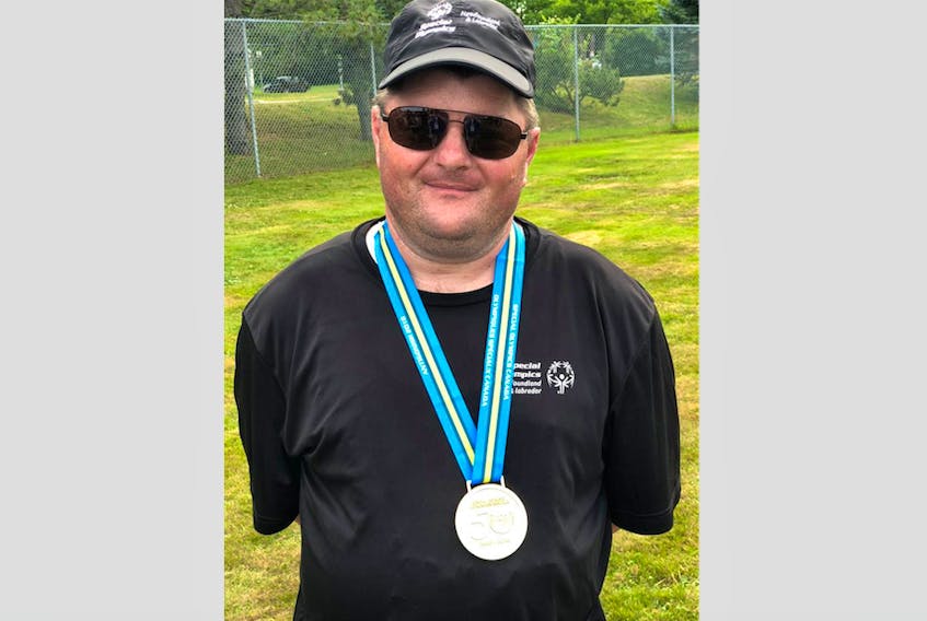 Tony Moores with his gold medal for the standing long jump. - Special Olympics Newfoundland and Labrador’s Facebook page