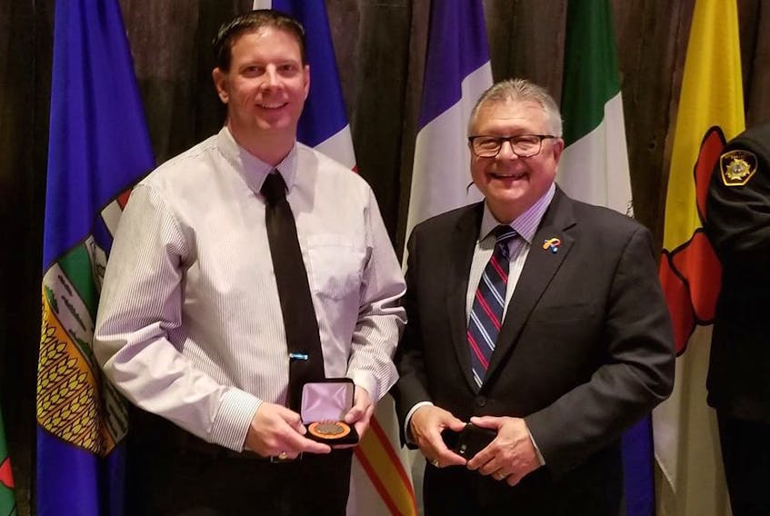 Trevor Miller was presented with the Emergency Management Exemplary Service Award by Public Safety and Emergency Preparedness Minister Ralph Goodale during a ceremony in Ottawa on Thursday, May 24. - Trevor Miller (Facebook)