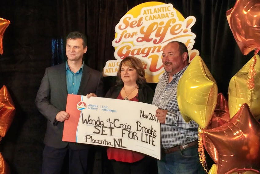 Wanda and Craig Brooks were presented with $675,000 in winnings from the Atlantic Lottery Corporation during a celebration in Placentia Thursday morning, the payday from a Set for Life scratch ticket Wanda received for her birthday. Vernon Hoben (left), a field sales specialist with Atlantic Lottery, made the presentation.