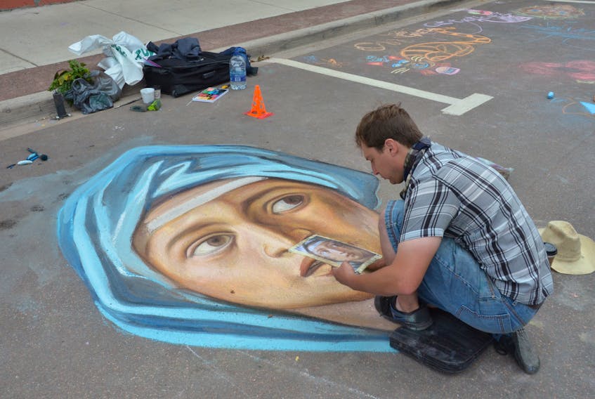 Under the town’s new recreation master plan, Sackville will bring back its Street Chalk Art Festival as an annual event. The festival, which was first held in 2017, was on hiatus last year due to a lack of funding. Above, François Pelletier, who makes his living as a pavement artist in Ottawa, puts the finishing touches on one of his masterpieces ON Bridge Street during Sackville’s 2017 festival.