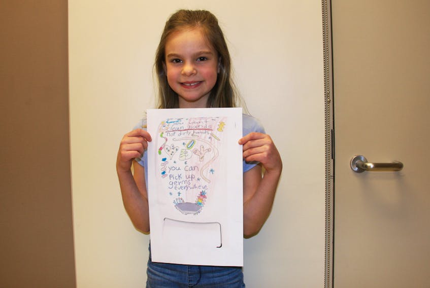 Sadie Anderson, a Grade 3 student at East Antigonish Education Centre, holds up her artwork which has been chosen as one of five finalists in the elementary school category for the national SC Johnson Professional Happy Hands Contest. The winner is chosen through online voting which closes at midnight, Feb. 14.
