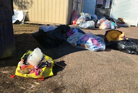 Clothing items are left scattered around the Salvation Army’s Amherst thrift store that has been closed for three weeks.