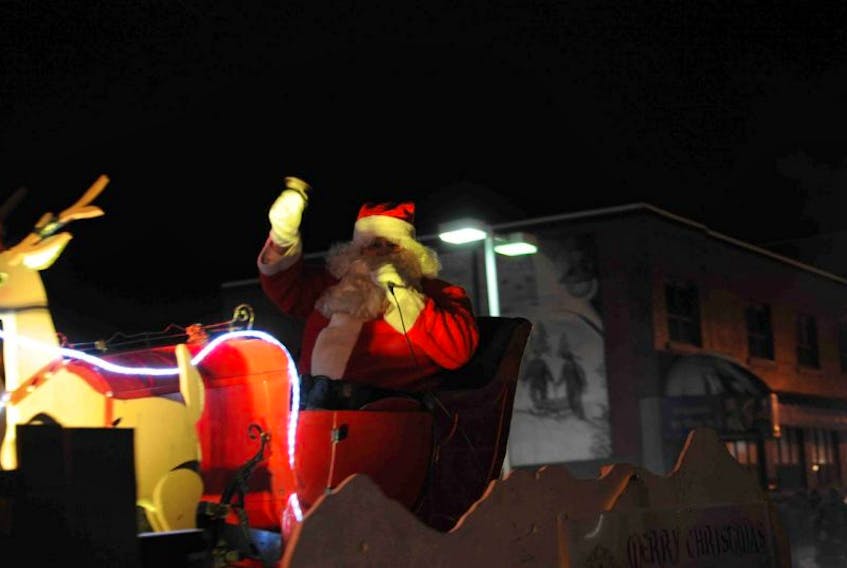 Santa Claus greets bystanders during the 2016 parade in Corner Brook.