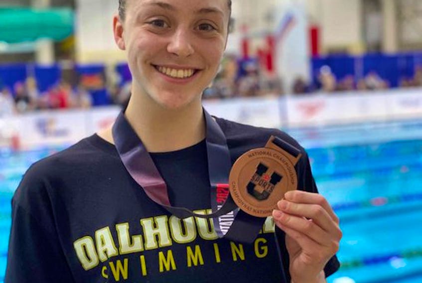 Dalhousie Tigers' Isabel Sarty displays the bronze she won in the 50-metre freestyle at the U Sports swimming championship in Victoria, B.C., on Friday night. Contributed