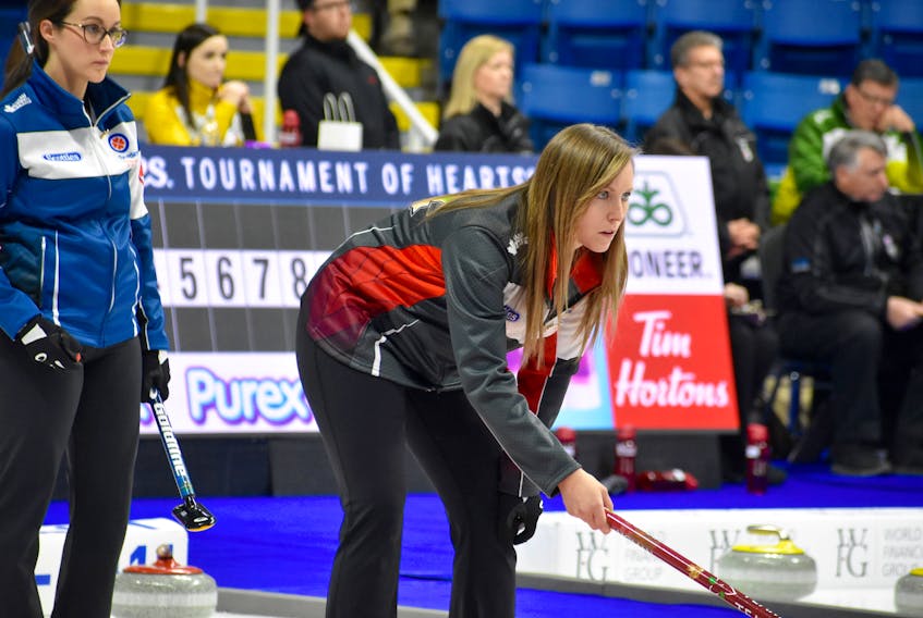 Nova Scotia skip Jill Brothers looks on as Ontario skip Rachel Homan, right, is a study in concentration as she watches the line of a teammate's shot during Sunday evening action at the Scotties Tournament of Hearts at Centre 200 in Sydney. The three-time national women's curling champion led her team to a 6-3 win over the Nova Scotia rink to remain undefeated with a 3-0 record. Nova Scotia fell to 0-3. Action resumes Monday with draws at 9:30 a.m., 2:30 p.m. and 7:30 p.m.
