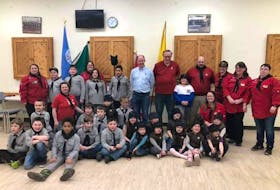 Members of the 1st Parrsboro Scout group were joined by Cumberland South MLA Tory Rushton (back, centre) to help celebrate Scout-Guied Week at the Parrsboro Fire Hall.
