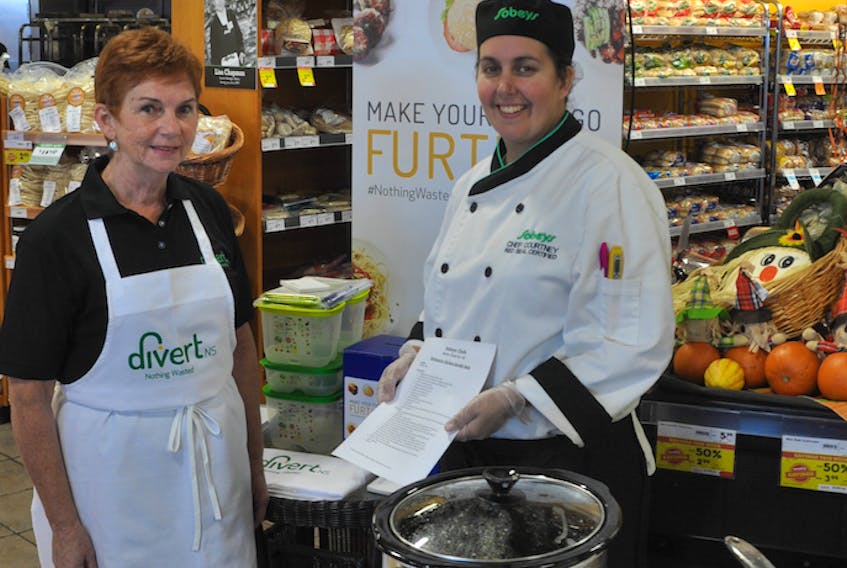 Susan MacDonald, left, and Courtney MacDonald, offering shoppers at the Aberdeen Sobeys advice on how to more efficiently use food – and the samples of what kinds of dishes can be created by doing so.